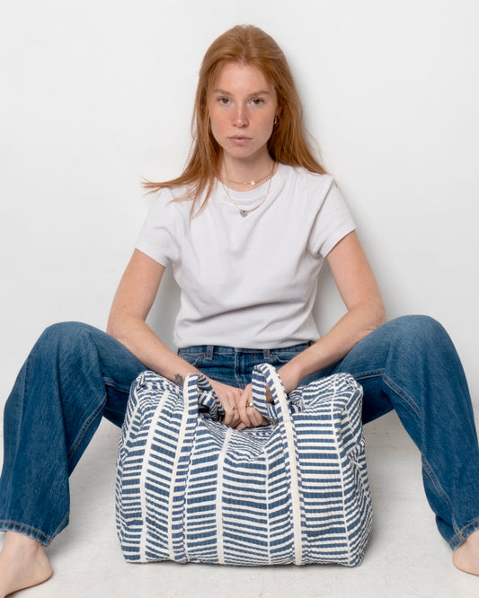 Borsone a righe blu e bianco