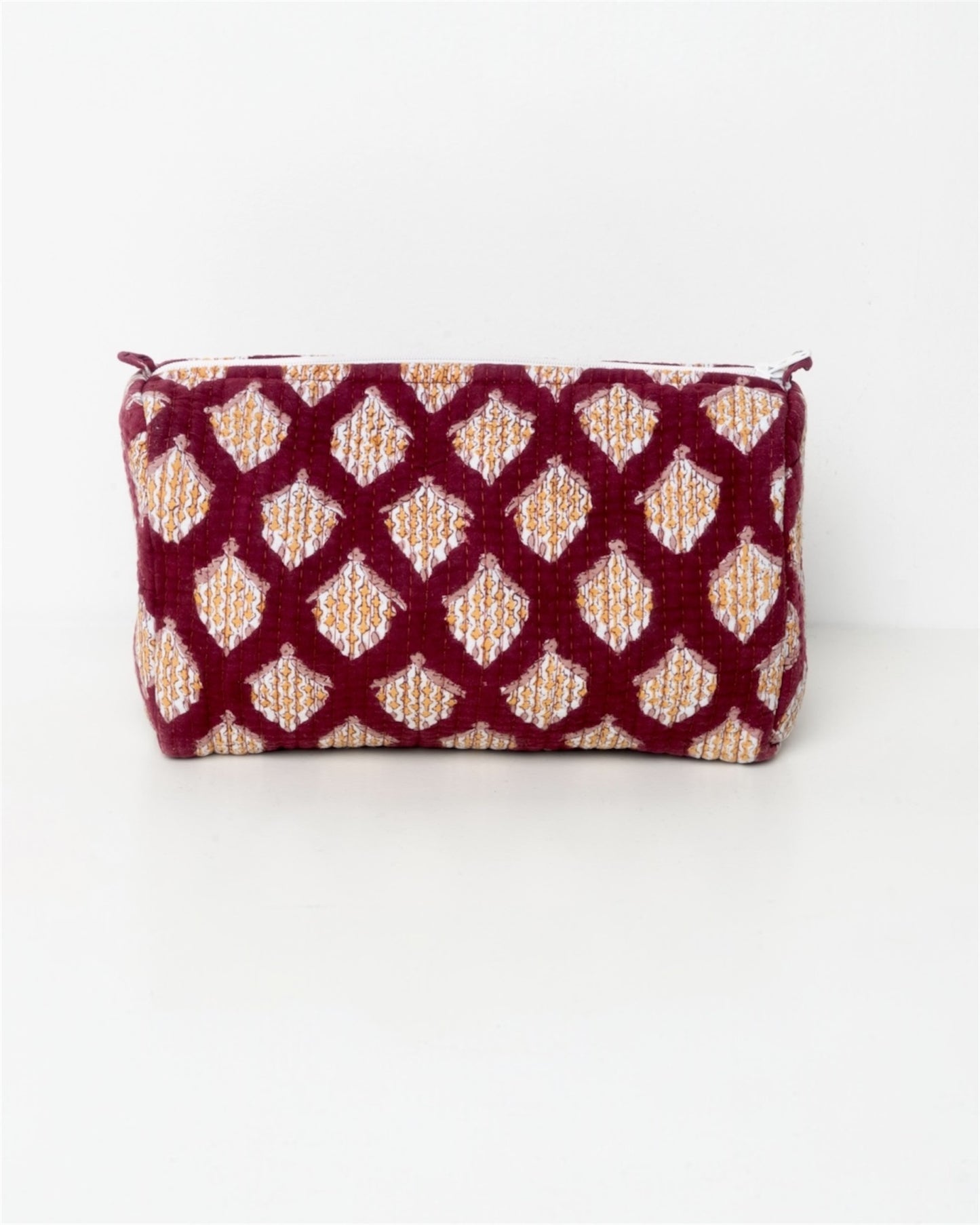 Beauty con fantasia senape su fondo prunga