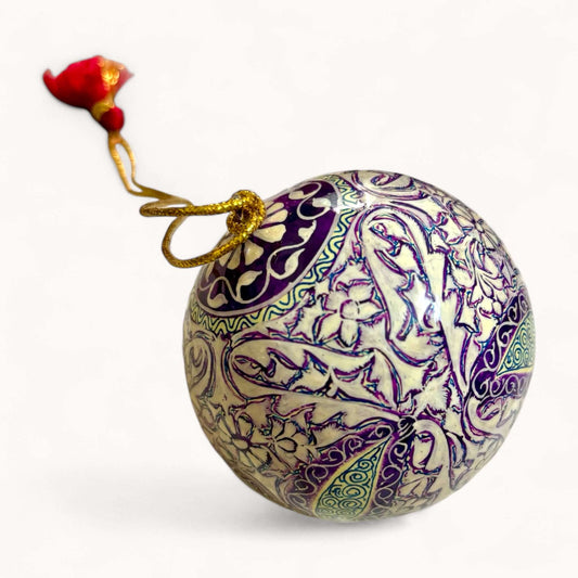 Hand-painted papier maché Christmas ornament with purple and green paisley design from Srinagar, Kashmir, diameter 8 cm.