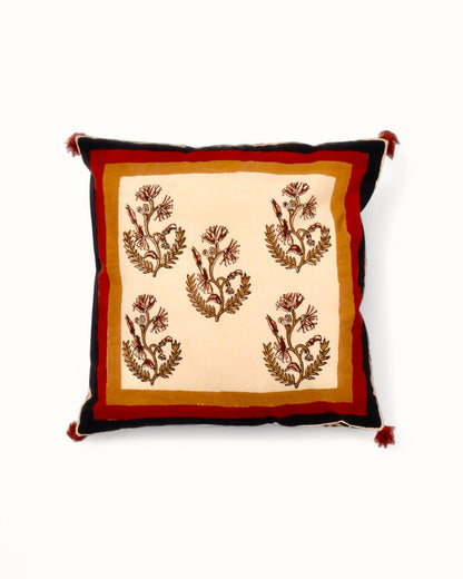 Moghul design cushion cover with autumnal hues, featuring a beige background, brown motif, and red floral pattern on black.