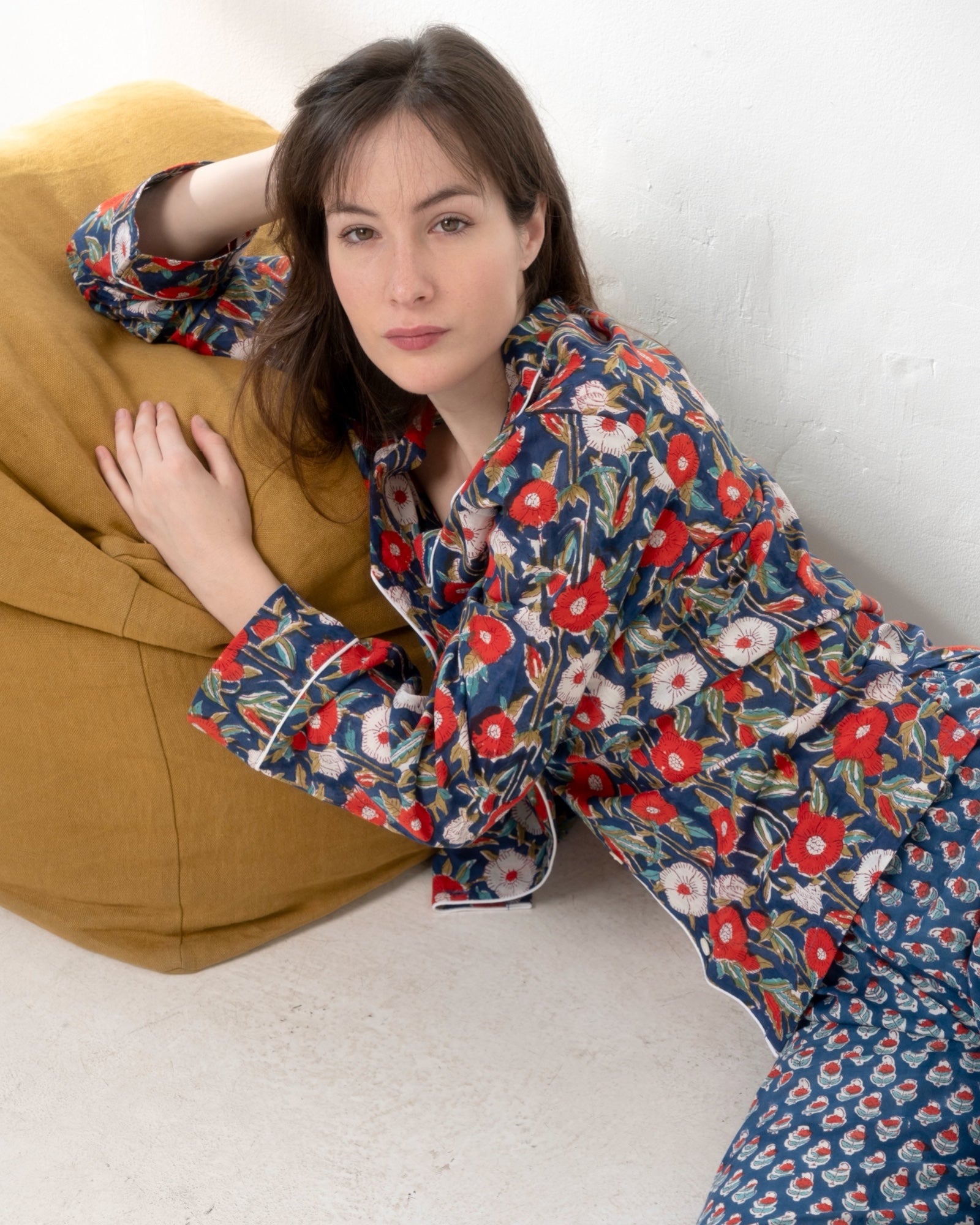 Hand-printed cotton pajama with pearl buttons and white piping detail.