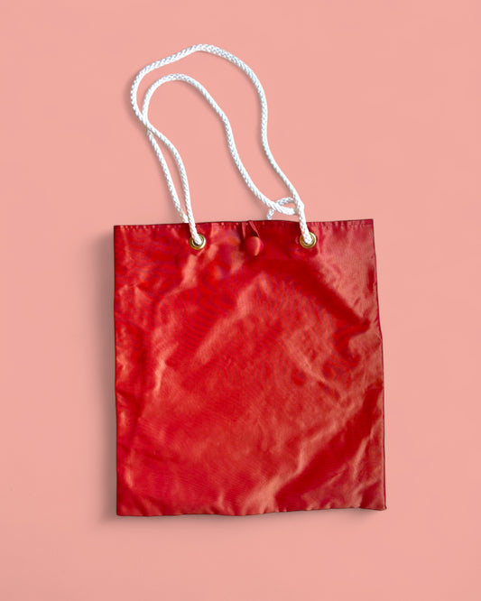 Tote bag in taffetà rosso-aranciato con manici in corda